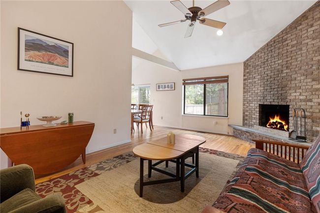 Living room with stone fpl & hardwood floors | Image 9