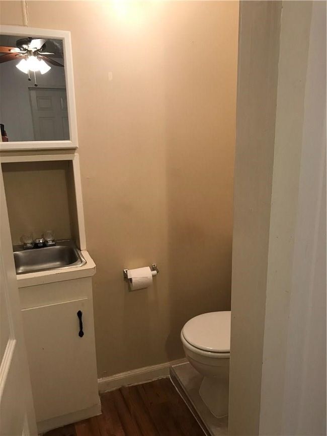 Bathroom featuring vanity, wood finished floors, and a ceiling fan | Image 10