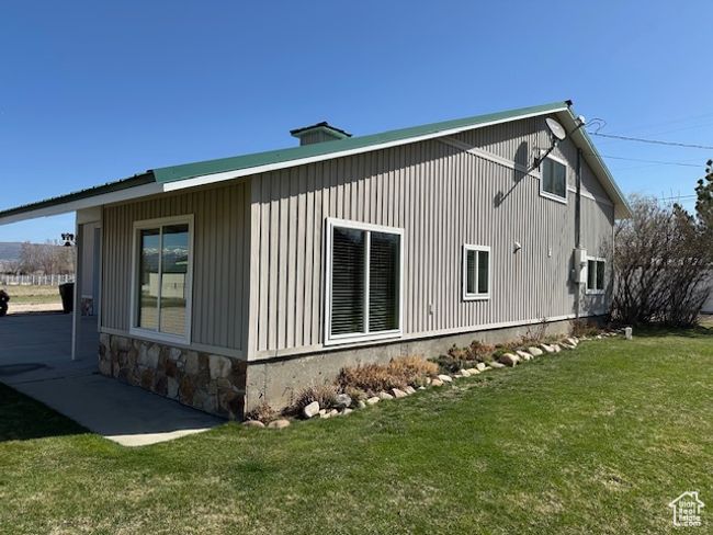 View of side of property with a yard and stone siding | Image 4