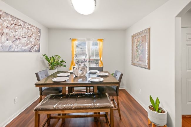 Dining space with dark hardwood / wood-style floors | Image 5