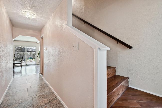 Front entry hall with stairs to the second floor bedroom and flex space. | Image 4
