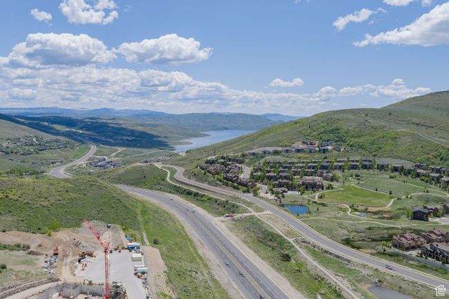 Bird's eye view of a water and mountain view and a main thoroughfare | Image 49