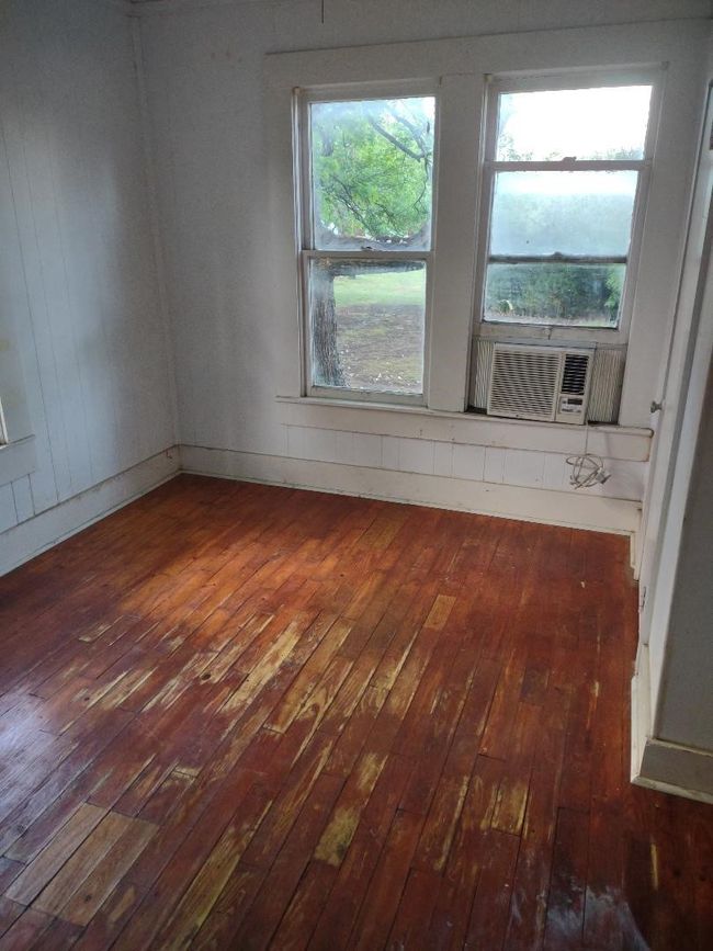Unfurnished room with hardwood / wood-style floors and cooling unit | Image 24