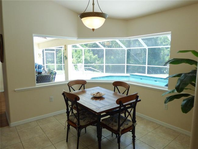 the breakfast nook or Dinette is spacious with panoramic extended view on the pool area | Image 20