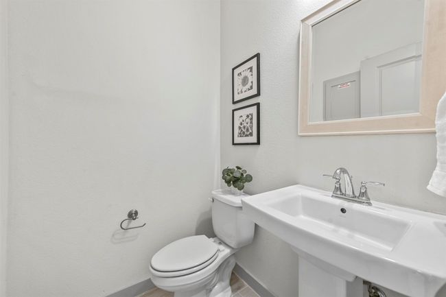 Bathroom featuring sink and toilet | Image 35