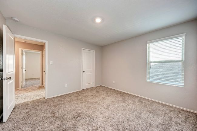 Unfurnished bedroom with carpet and baseboards | Image 23