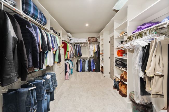 Spacious closet with carpet floors | Image 26