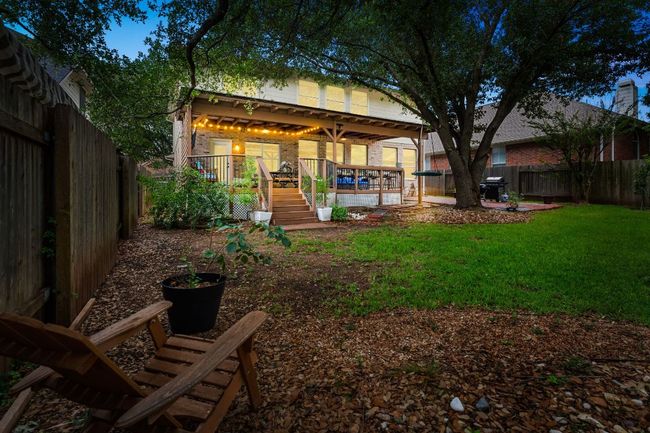 View of yard with a wooden deck and stairway | Image 40