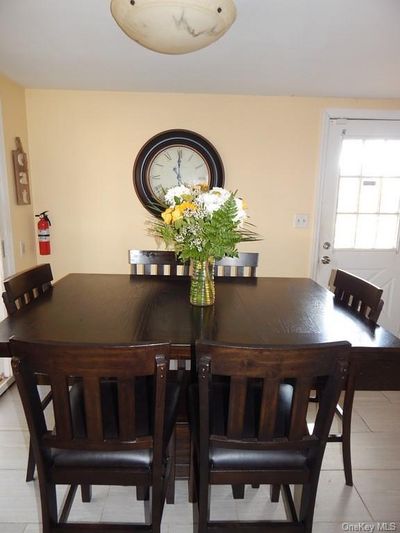 View of tiled dining area | Image 3