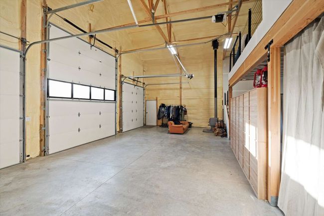 Garage with a garage door opener | Image 13