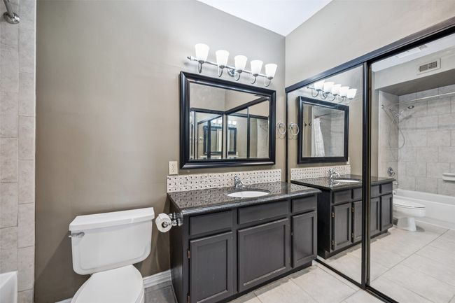 Primary suite bathroom and closets (behind sliding mirrors) | Image 18