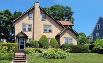 View of front of property with a front lawn Beautiful flowers and evergreens for enjoyment. Sidewalks for easy access to downtown White Plains. | Image 2