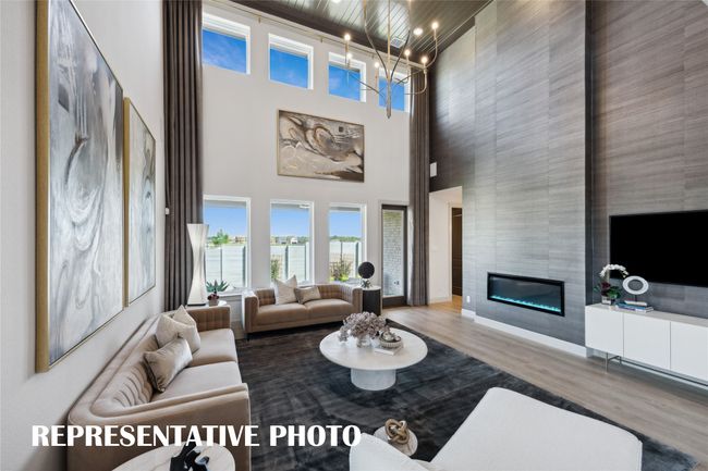 Dual story windows flood this family room with natural light! REPRESENTATIVE PHOTO | Image 9