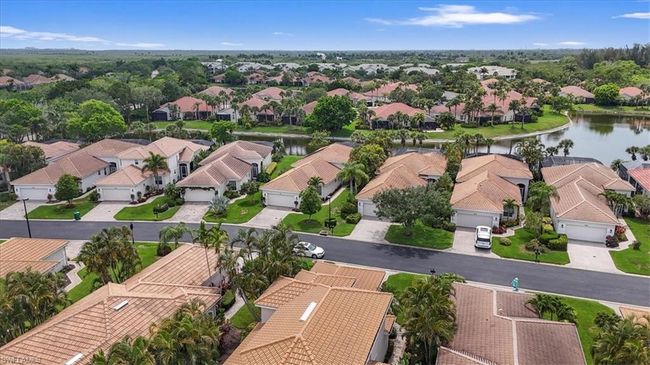 Aerial perspective of suburban area with a nearby body of water | Image 41