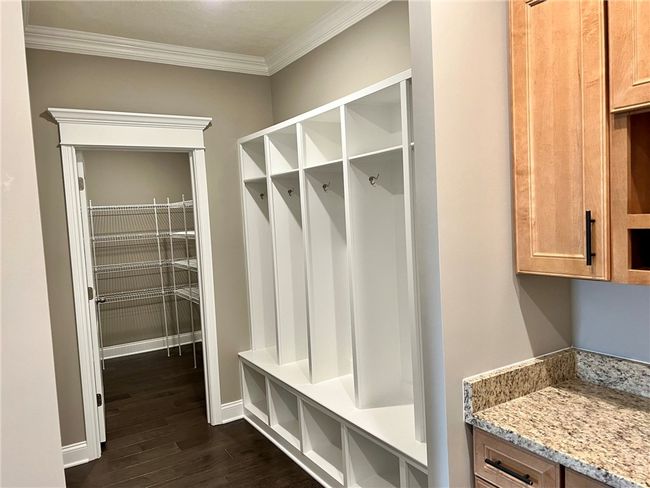 Built in lockers and oversized kitchen pantry | Image 16