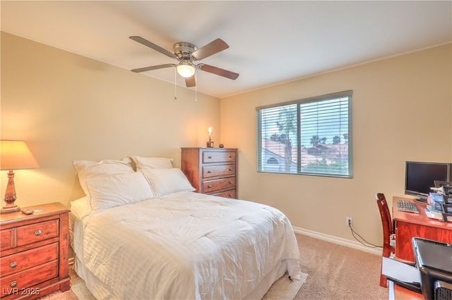 Bedroom featuring light carpet and a ceiling fan | Image 14