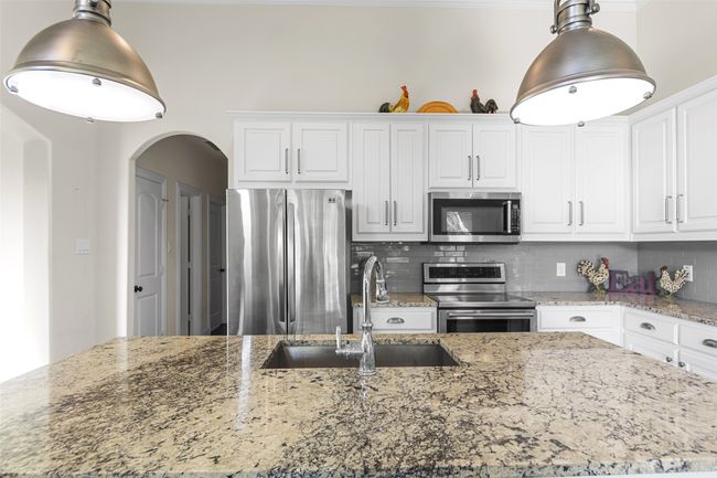 Close up of this beautiful granite island with stunning pennant lights! | Image 14