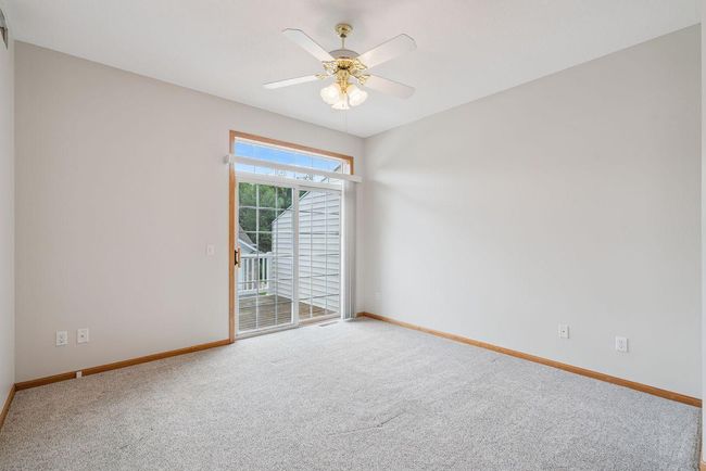 Owner suite bedroom with separate private sliding glass door leading out to large back deck (28x10) | Image 16
