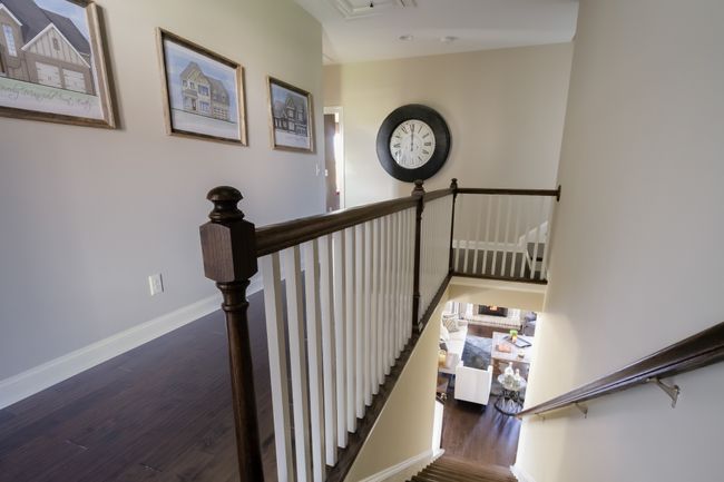 The hardwoods continue to the upstairs hallway. | Image 40