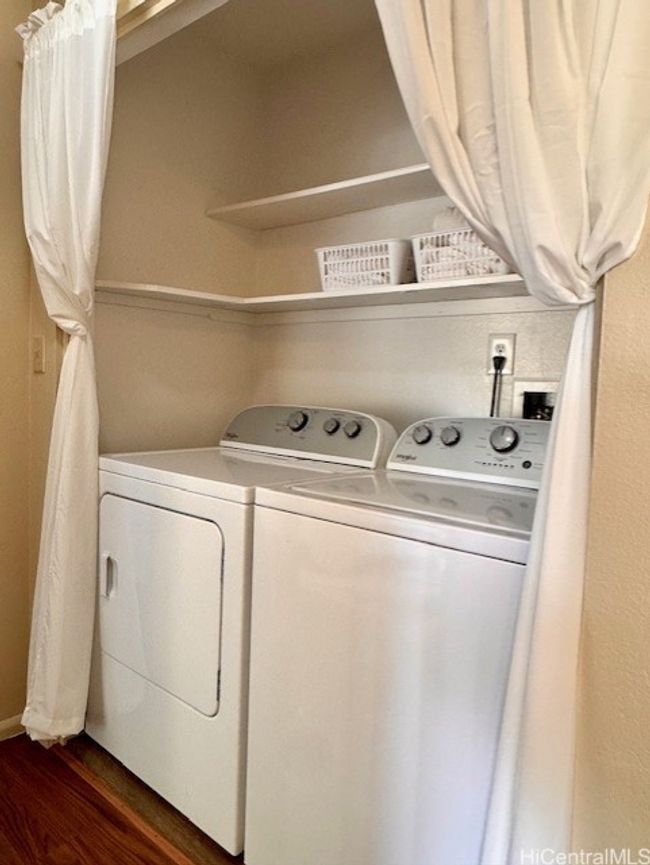Laundry center upstairs near bedroom | Image 11