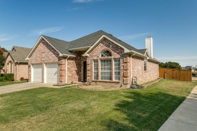 View of front of home featuring a garage and a front lawn | Image 3