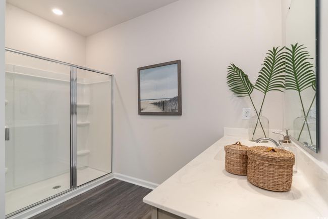 Bathroom featuring wood finished floors, vanity, and a shower stall | Image 19