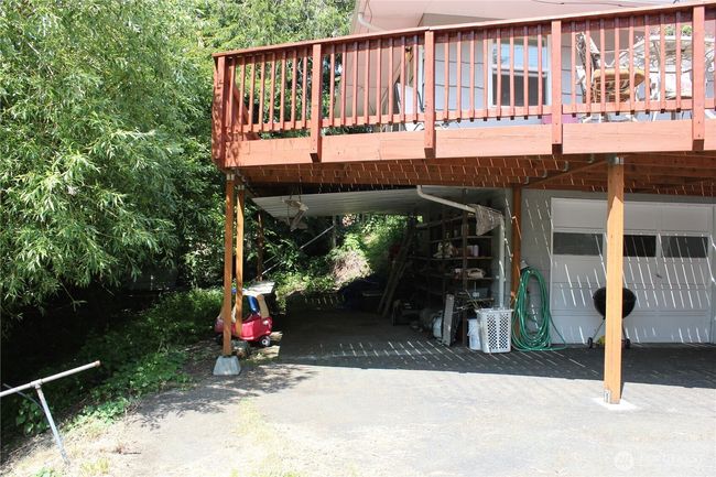 carport space would be a great outdoor kitchen location | Image 22