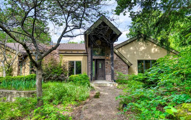 View of front of home with stucco siding and stone siding | Image 4