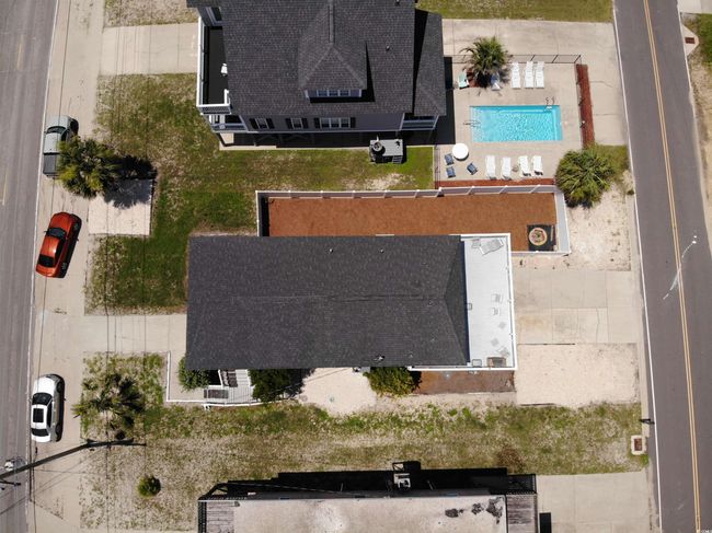 Aerial view of property and surrounding area with a pool | Image 25
