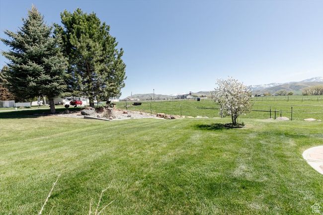 View of yard featuring a rural view and a mountain view | Image 19