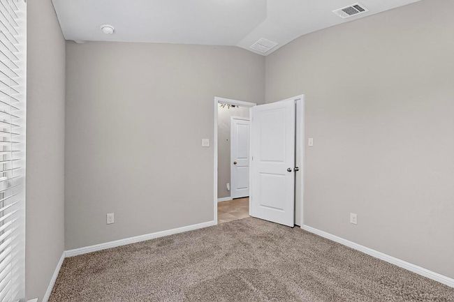 Empty room featuring lofted ceiling and carpet floors | Image 32