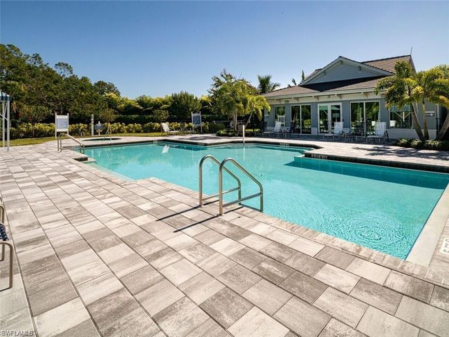 View of swimming pool with a patio area | Image 29