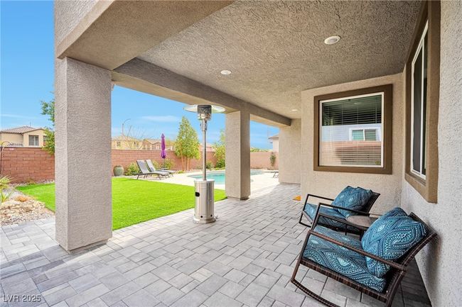 View of patio featuring a fenced in pool and a fenced backyard | Image 30