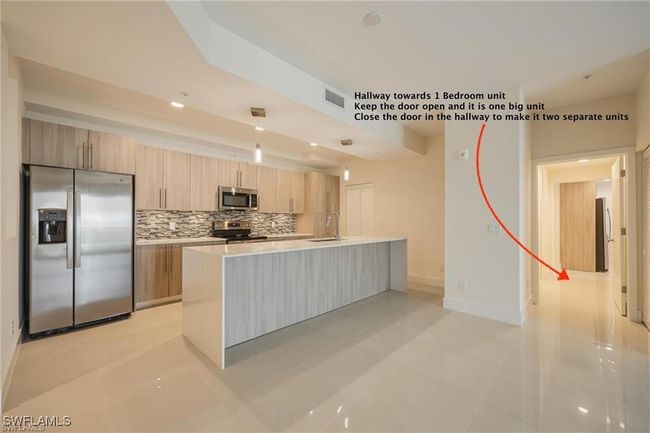 Kitchen with light countertops, visible vents, modern cabinets, decorative backsplash, and appliances with stainless steel finishes | Image 4
