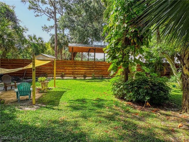 View of yard with a fenced backyard | Image 25