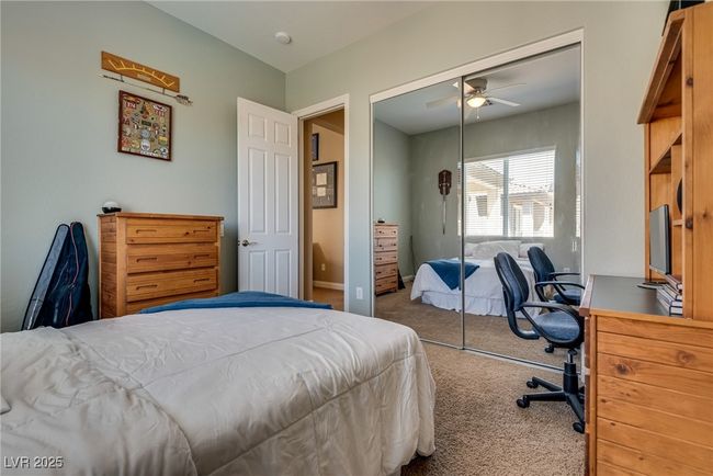 Carpeted bedroom with a closet and ceiling fan | Image 44