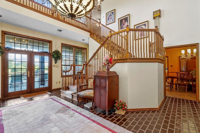 Entrance foyer featuring french doors and a high ceiling | Image 10