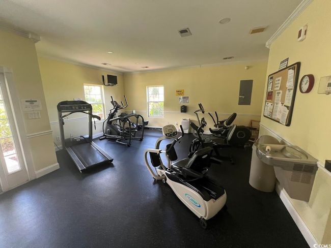Gym with crown molding and electric panel | Image 14