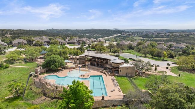 Stay cool all summer at the neighborhood amenity center with a resort-style pool, lap swim lanes, toddler pool, and water play area. | Image 35