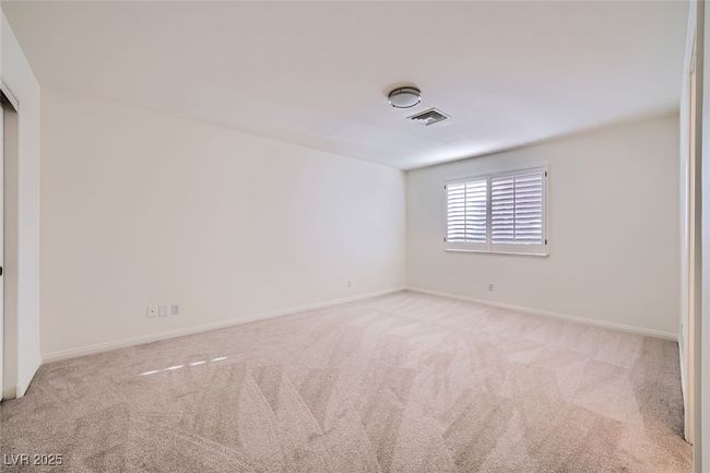 Carpeted empty room featuring baseboards and visible vents | Image 43
