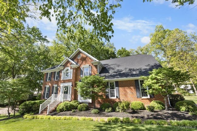 View of front of house featuring brick siding and a front yard | Image 4