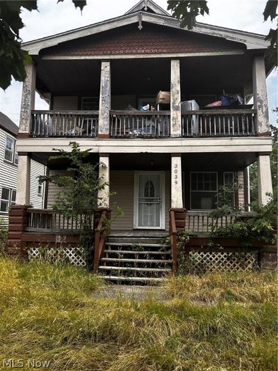 View of front of home featuring a balcony and a porch | Image 1