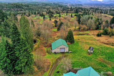 Huge garage, little cottage to your right. What a view! | Image 3