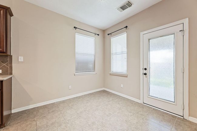 Breakfast area conveniently located next to the kitchen, family room, and access to the backyard patio | Image 20