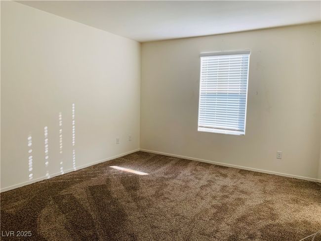 Spare room featuring baseboards, a healthy amount of sunlight, and carpet flooring | Image 8
