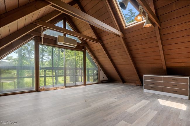 Bonus room featuring wood ceiling and wood finished floors | Image 30
