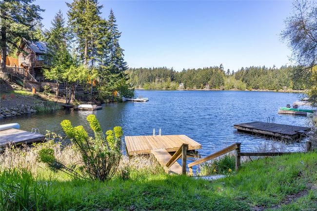 Dock area featuring a lake view | Image 37