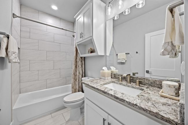 Upstairs ensuite bath with high end fixtures and modern finishes | Image 36