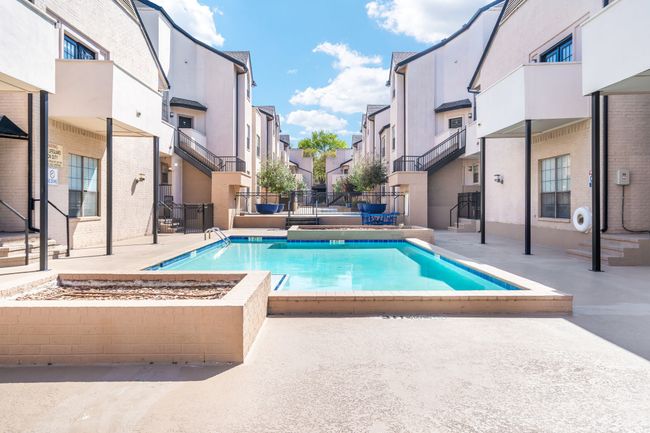 Community pool featuring and patio lounge space | Image 16