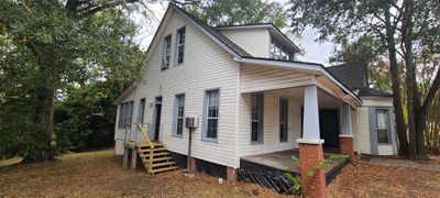 Left side of home. Stair case recently rebuilt | Image 2